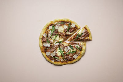 Directly above shot of pizza against white background