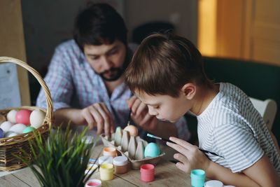 Mother carrying daughter at home