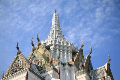 Low angle view of old temple against blue sky