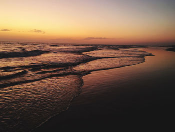 Scenic view of sea against clear sky during sunset