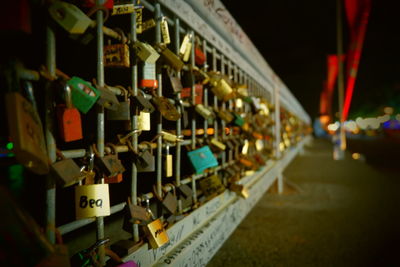 Close-up of padlocks on railing