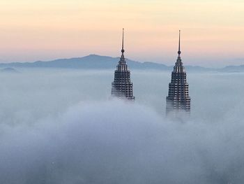 View of skyscrapers in foggy weather