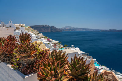 Scenic view of sea against clear blue sky