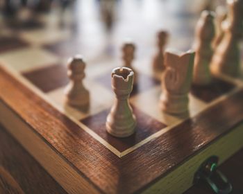 Close-up of chess pieces on table