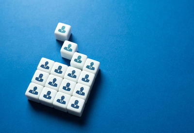 High angle view of toy blocks on blue background