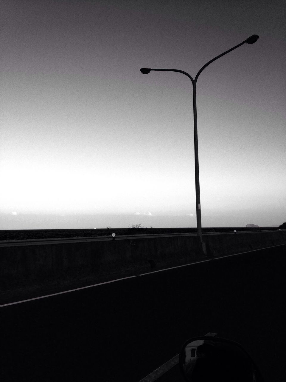 low angle view, electricity, power line, lighting equipment, cable, street light, connection, clear sky, power supply, technology, transportation, silhouette, sky, built structure, electricity pylon, dusk, no people, architecture, indoors