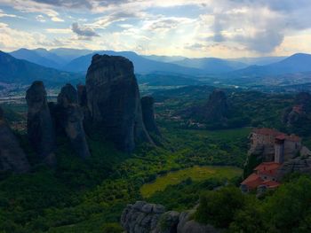 Scenic view of landscape against cloudy sky