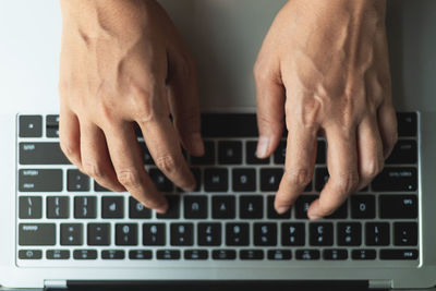 Close-up of hand using mobile phone