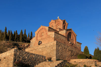 Low angle view of church of st john at kaneo against clear sky