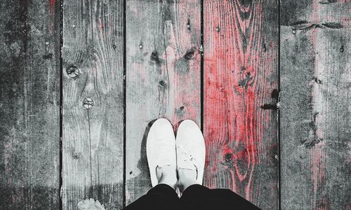 Man standing on wooden floor