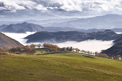 Scenic view of landscape against cloudy sky