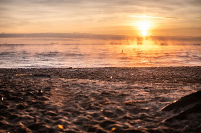 Scenic view of sea against sky during sunset