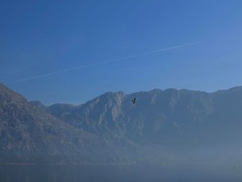 Scenic view of mountains against clear blue sky