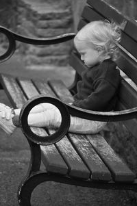 Cute girl sitting on bench