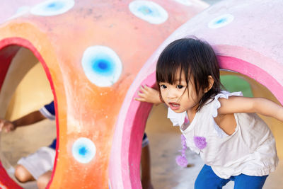 Baby girl standing at playground