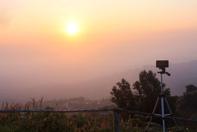 Scenic view of field against sky during sunset