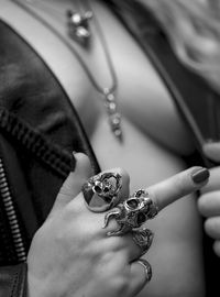 Cropped hand of woman holding pocket watch