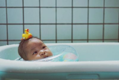 Portrait of boy in bathroom at home