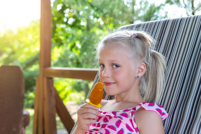 Portrait of a girl holding ice cream