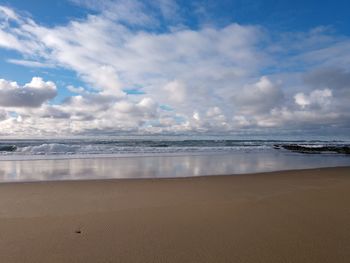 Scenic view of beach against sky