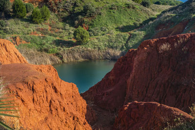 Scenic view of lake amidst bauxite cave