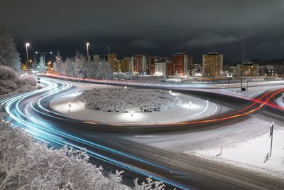 High angle view of light trails on road in city