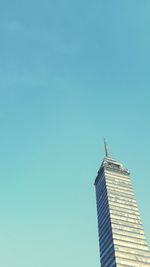 Low angle view of built structure against clear blue sky