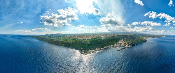 Timpa di acireale aerial view from above on santa maria la scala with sea and blue sky