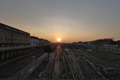 High angle view of railroad tracks against sky during sunset