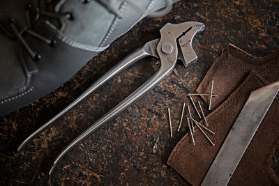 High angle view of work tools on field