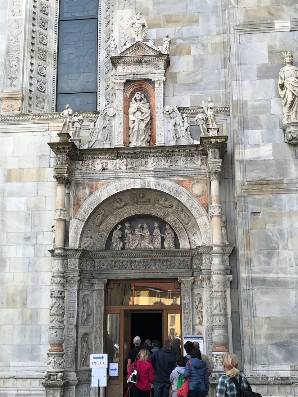 GROUP OF PEOPLE IN FRONT OF BUILDING