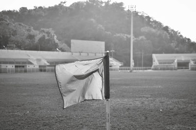 Clothes drying on field against trees