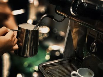 Close-up of hand holding coffee cup