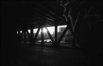 Silhouette of bridge at night