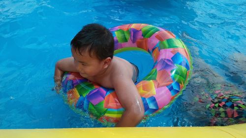 High angle view of boy in swimming pool