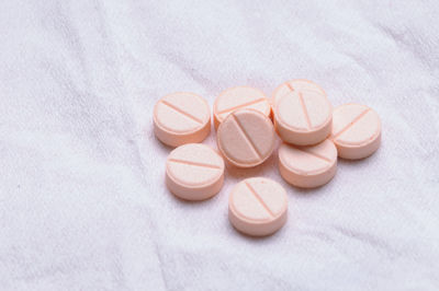 Group of pink tablet of medicine, studio shot