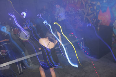 Woman dancing at nightclub 