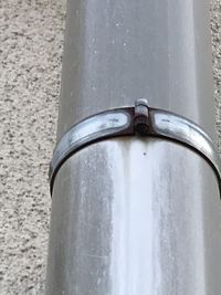 Close-up of coin-operated binoculars against wall