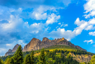 Low angle view of mountain against blue sky