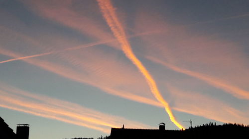 Low angle view of vapor trails in sky