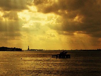 Scenic view of sea against cloudy sky