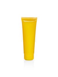 Close-up of yellow drink against white background