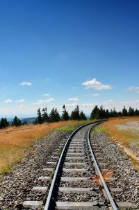 Surface level of railroad tracks against sky