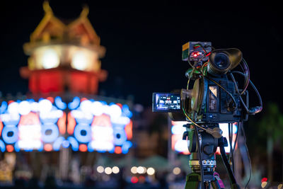 Close-up of camera against black background