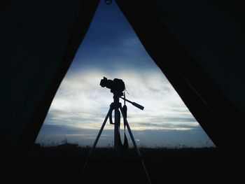 Low angle view of camera against sky