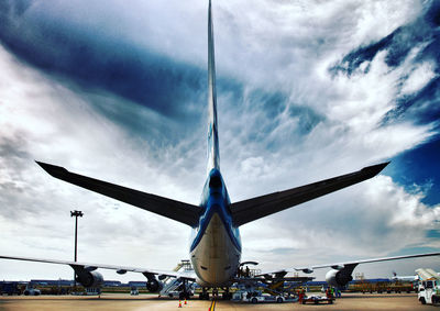 Low angle view of airplane against sky