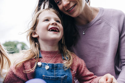 Portrait of happy mother with daughter