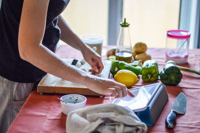Midsection of woman preparing food