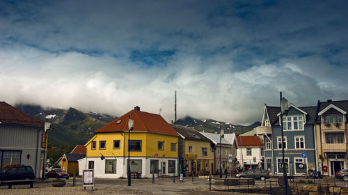 Houses in city against sky