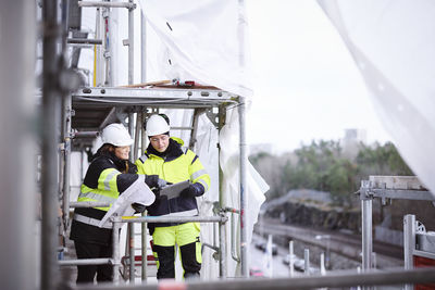 Engineers talking at building site